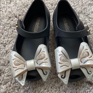 Mini Melissa black toddler shoes with white bow